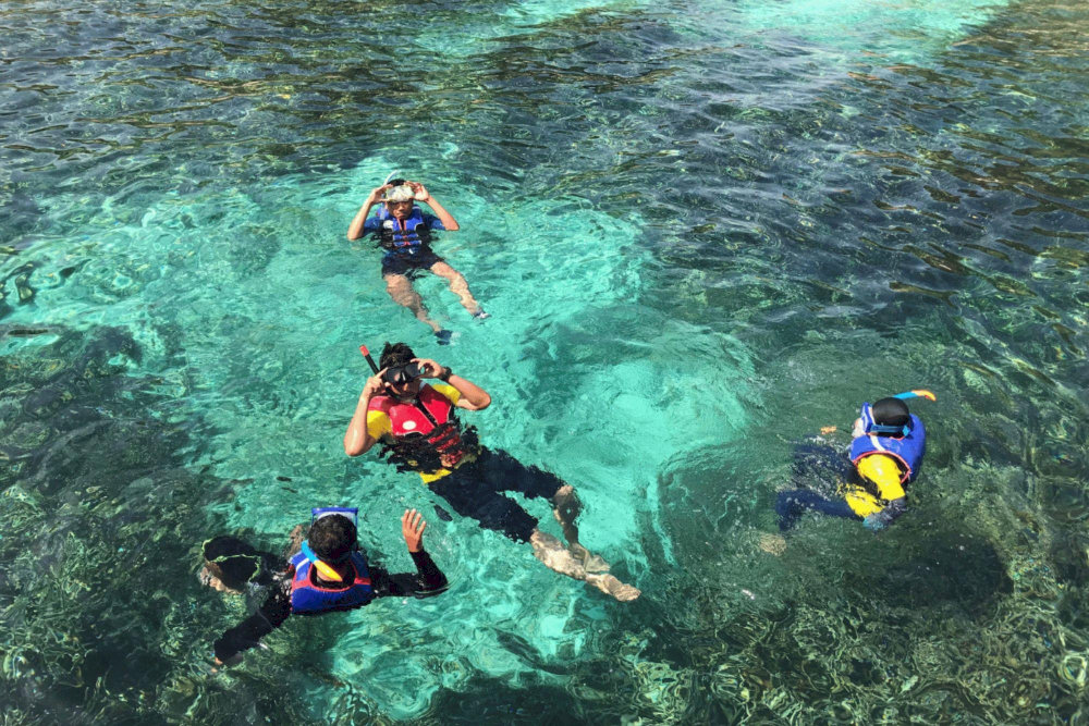Swimming and snorkeling are favorite activities for visitors at Bai But and Bai Dai beaches